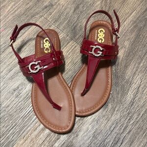 GBG Los Angeles Patent Burgundy T-Strap Sandals with Silver G Accent